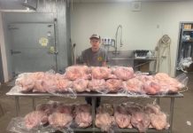 W.Va. FFA member wins national award guy with table full of turkeys