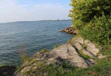 Ohio bill creates state watershed program Lake Erie shore and rocks.