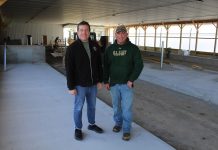 The pandemic shaped this Pennsylvania dairy farm’s success men standing in new free stall barn