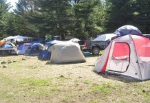Practical learning key to livestock guardian dog seminar tents in a pasture
