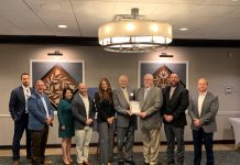 Encino Energy wins award for excellence people standing in a row accepting an award