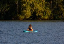 Enjoying all that returning home has to offer paddle board