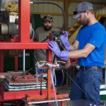 Fitch Pharm Farm relies on farmer mentors to diversify Two men demonstrate how a cider press works.