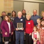 Ohio sheep farmers focus on improved flock genetics at 2021 symposium A family poses together after receiving an award.