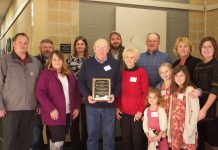 Ohio sheep farmers focus on improved flock genetics at 2021 symposium A family poses together after receiving an award.