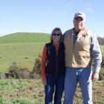 With conservation, what goes around comes around at Meadow View Farm Two people stand on a farm.