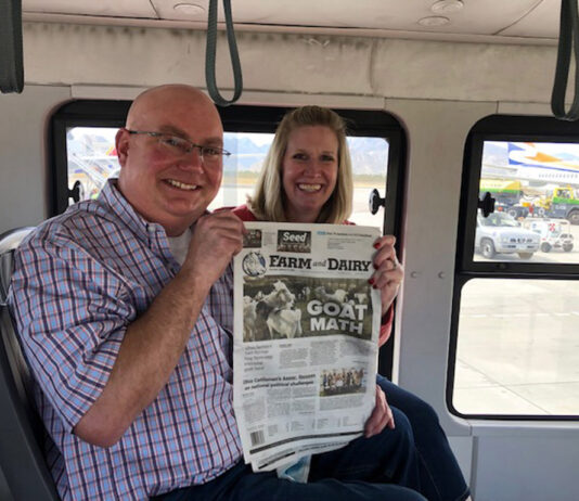 Visiting Cabo San Lucas with the Weavers Lance and Jaimye Weaver hold the Farm and Dairy on the bus in Cabo San Lucas, Mexico