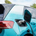 Ohio communities get help switching fleets to alternative fuels a charging cord is plugged into an electric car behind the rear passenger door