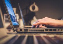 Ohio leaders discuss broadband, tourism at state of the region event person using silver laptop computer on desk