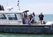 Researchers forecast mild algal bloom for Lake Erie Researchers take water samples from a boat in Lake Erie