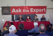 Farm Science Review: Farm incomes strong; inflation, inputs are challenges four people speak from a stage
