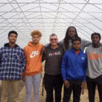 Mansfield students explore ag through new career tech program Five students and a teacher stand in a high tunnel