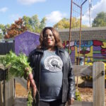 Southeast Gardens and Urban Farm focuses on community, sustainable ag A woman stands in front of a garden in Columbus.