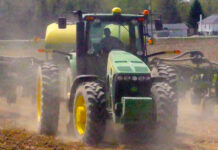 Stark Co. farmer Ben Klick embraces technology, new challenges tractor plowing field kicking up dust