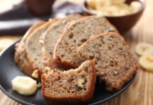 Banana Walnut Bread Sliced banana bread with nuts on plate