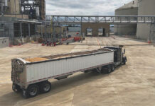 Ohio’s soybean processing capacity is growing a tractor trailer full of soybeans drives at an angle into a soybean plant
