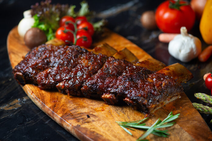 BBQ beef ribs steak served with a hot chili pepper and fresh to