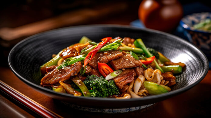 Delicious Chinese dish, featuring fried chopped pork with vegeta