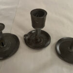 Numerous pioneer craftsmen turned out holders for candles