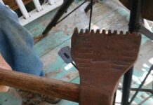 Can you identify this double-sided serrated axe?