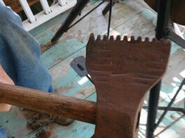 Can you identify this double-sided serrated axe?