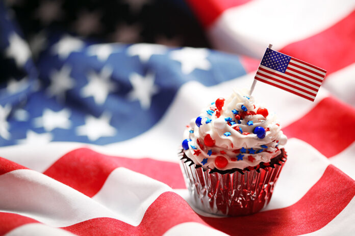 4th of July cupcake with flag and sprinkles