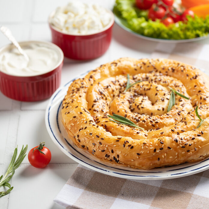 Homemade borek (burek) vertuta snail pie with cottage cheese