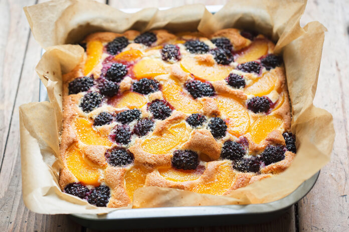 Cake with blackberries and peaches