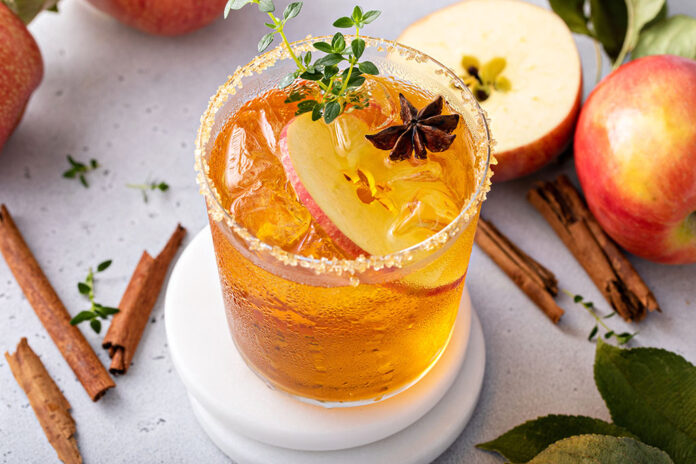 Apple cider margarita with brown sugar rim and fresh thyme